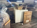 a refrigerator that is sitting in the middle of a room