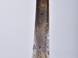 a close up of a sword with a gold plated handle