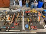 many tools that are sitting on a table in the garage
