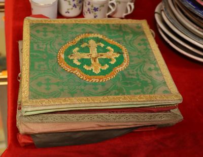 a book with a cross on it sitting on a table