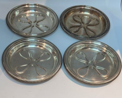 185. Suite de 4 dessous de bouteilles, première moitié XXe s…