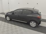 a picture of a black car parked in a garage