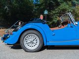 a blue car that is parked in the parking lot