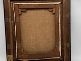 an old picture frame with a picture of a person in it