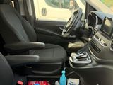 the interior of a van with the driver ' s seat folded down
