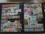 a black folder with a lot of stamps on it