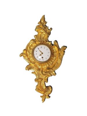 clock on a white background with a gold finish