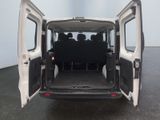 the back of a white van with its doors open in a parking lot