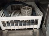 a dishwasher with a basket inside of it