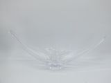 a clear glass bowl sitting on a white surface