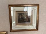 a picture hanging on the wall of a bathroom