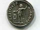 a silver coin with an image of a man holding a sword