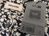 a close up of a shirt with a tag on it