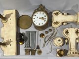 many different types of clocks on display in a display case
