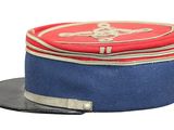 a blue hat with a red and white design on it