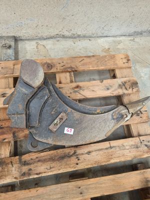 a wrenet sitting on a pallet next to a pair of scissors