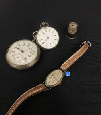 an image of a couple of watches sitting on top of a table