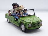 a green toy truck with people in it and a dog in the back