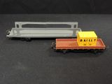 a small toy train with a box on it
