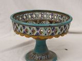 an image of a blue and gold bowl on a stand