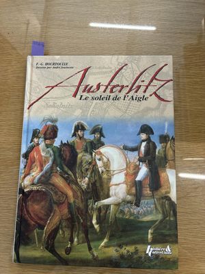 une image représentant un livre sur lequel figure une illustration d'un groupe d'hommes à cheval