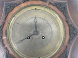 a clock that is hanging on the wall in the room