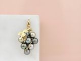 a close up of a white marble block with a bunch of pearls on it