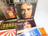 a lot of music books on the table