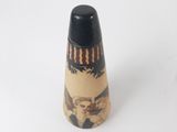 a small vase with a picture of a man on it