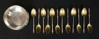 a lot of spoons and a bowl on a table