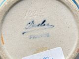 a close up of a vase with a label on it