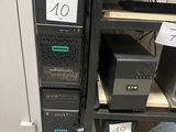 a computer tower with a lot of computers on top of it