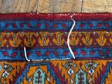a cat that is laying on a rug on the floor