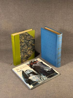 two books sitting next to each other on top of a table