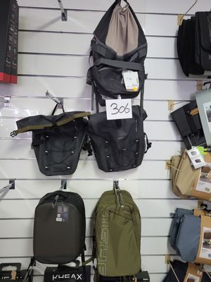 many bags hanging on the wall of a store