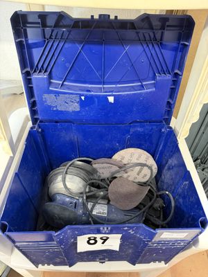 a blue box with a bunch of shoes inside of it