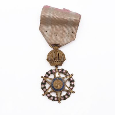 a close up of a medal with a star on it