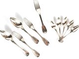 a lot of spoons and forks on a white surface