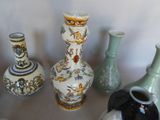 many vases that are sitting on a table