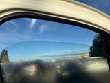 a reflection of a car in the side mirror of a car