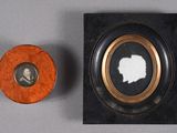 an old picture frame with a picture of a man and a woman in it