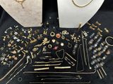several different types of jewelry are displayed on a table