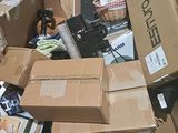 a large pile of boxes that are sitting on the ground
