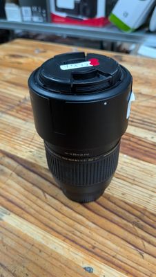 a camera lens sitting on top of a wooden table