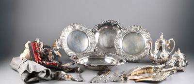 a silver plate with a lot of silver items on it