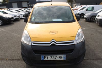 a yellow van that is parked in a parking lot
