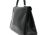 a black handbag on a white background