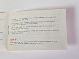 an open book with a picture of a game on it