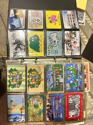 a suitcase full of cds and cds sitting on the ground