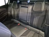 the back seats of a car are black and grey in color